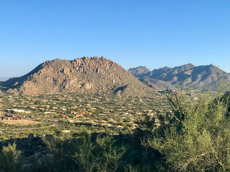 some hills and trees on the sides of the mountains