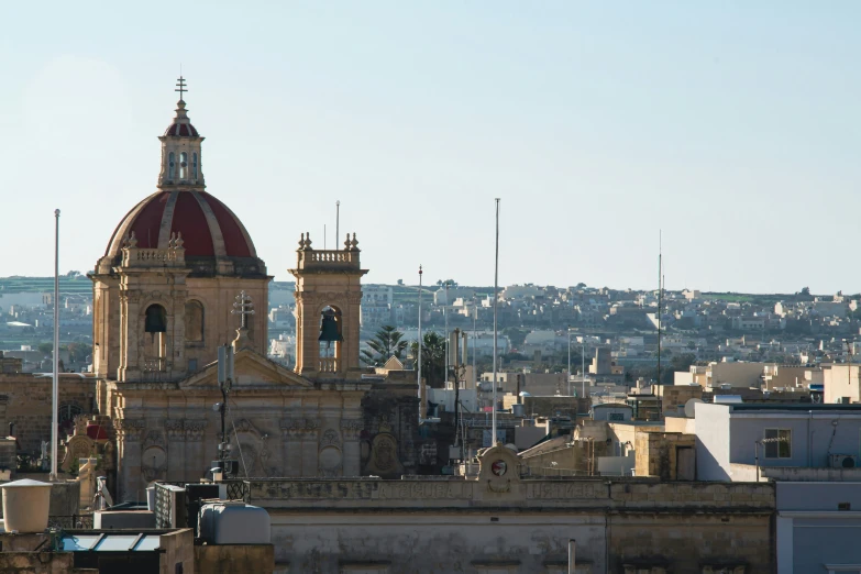 the large, ornate clock tower sits atop a city