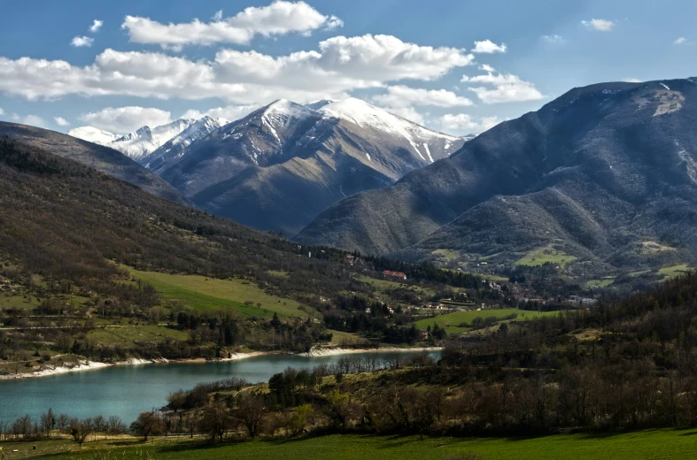 the view of mountains from the top of a hill