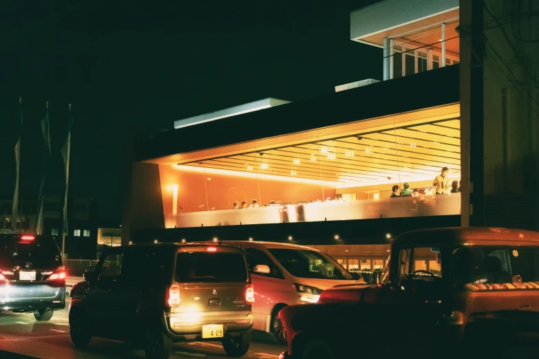 a night scene showing many cars on the street