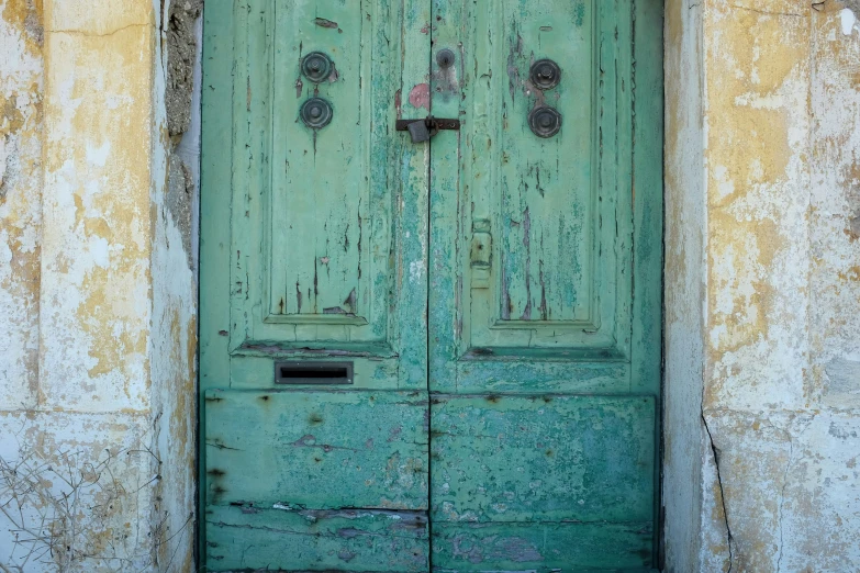 an old door with two s sitting outside