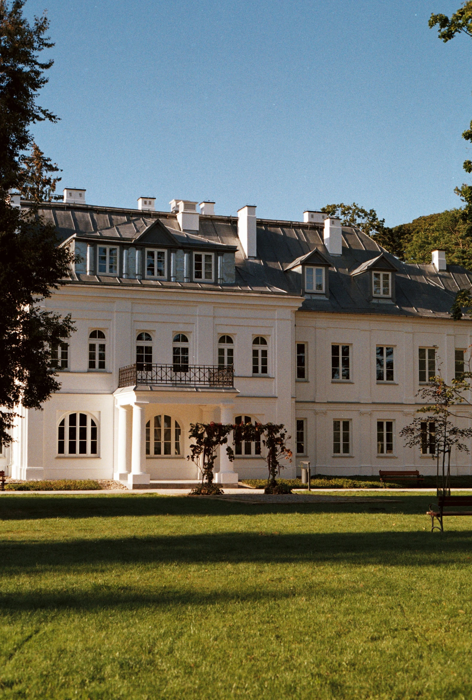 a building that is standing near some trees