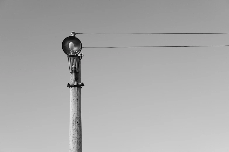 an electric pole with a street light attached