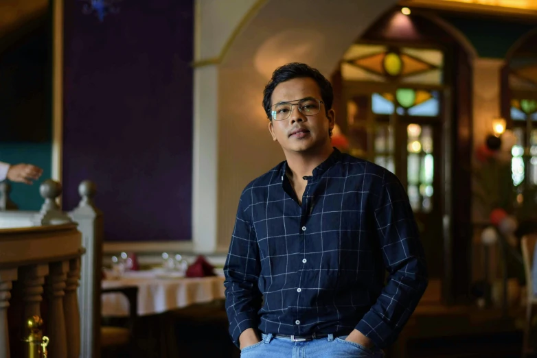 a man standing in front of a table while holding soing