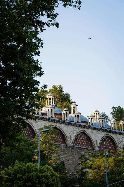 a city bridge with a clock tower in the distance