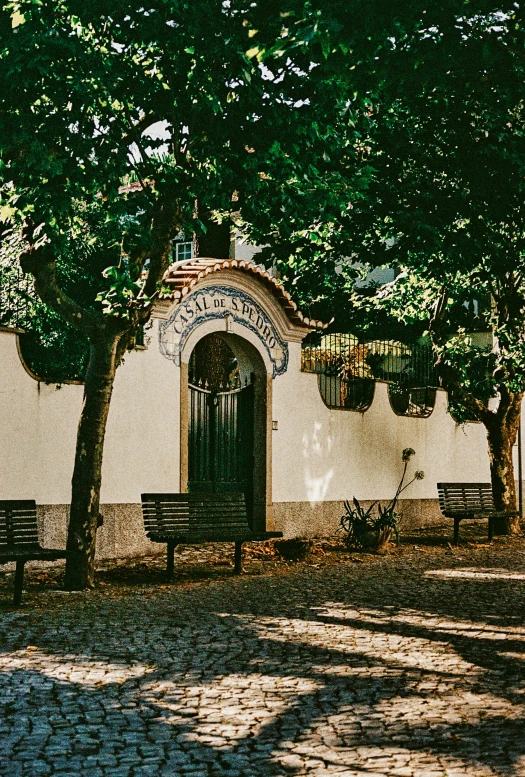 some benches near the side of a building