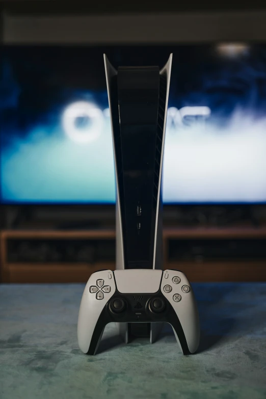 video game console in front of television on carpet