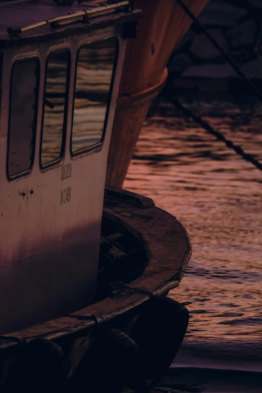 a small boat floating on top of a lake