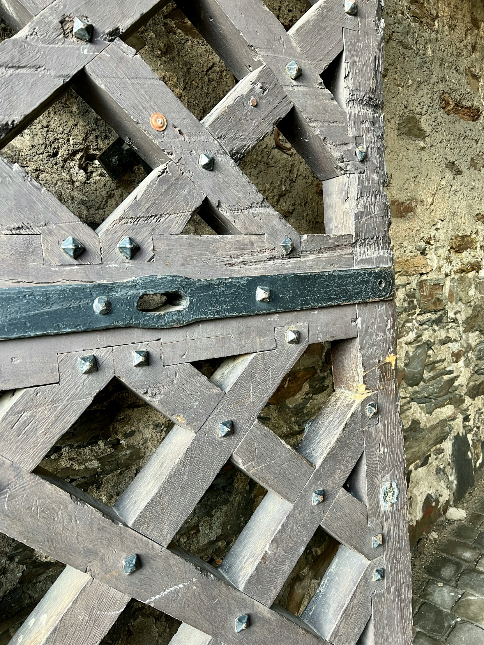 the gate is made of wood with bolts