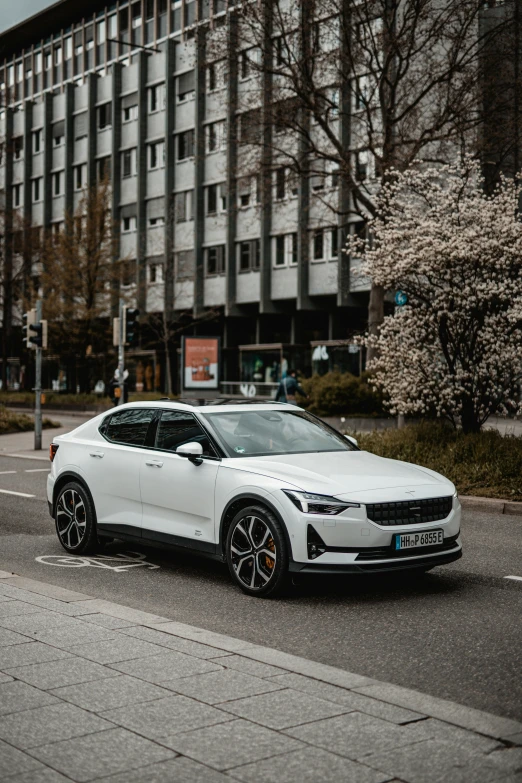 a white car on the side of a road