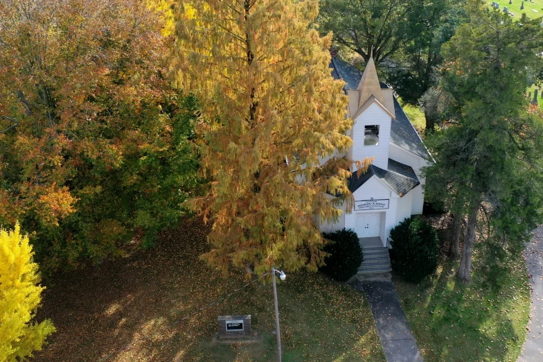 an aerial view of a house in the fall