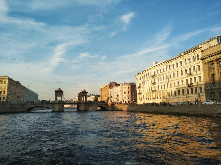 some buildings water and a bridge over it