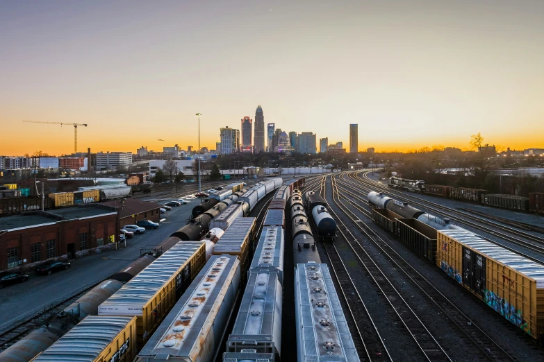 a couple of trains sitting next to each other on tracks