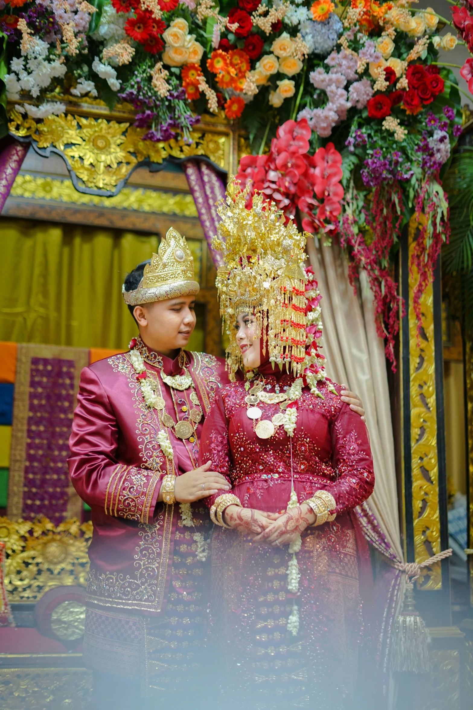 two people are dressed up as brides in traditional clothing