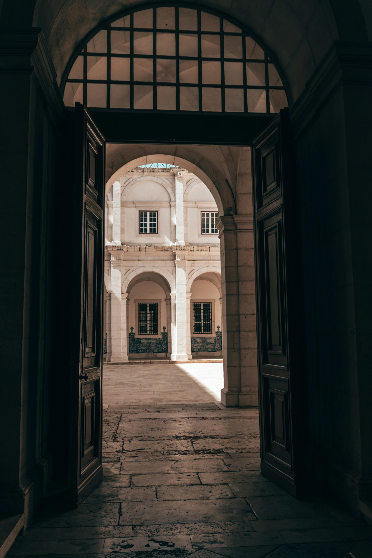 the entrance to a large building with doors opened