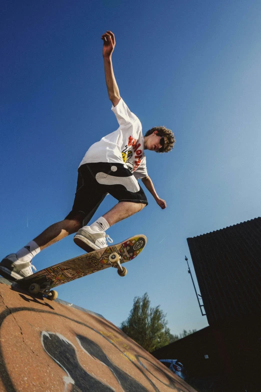 a man riding a skateboard up the side of a ramp