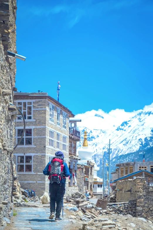 a person with a backpack walking up some steps