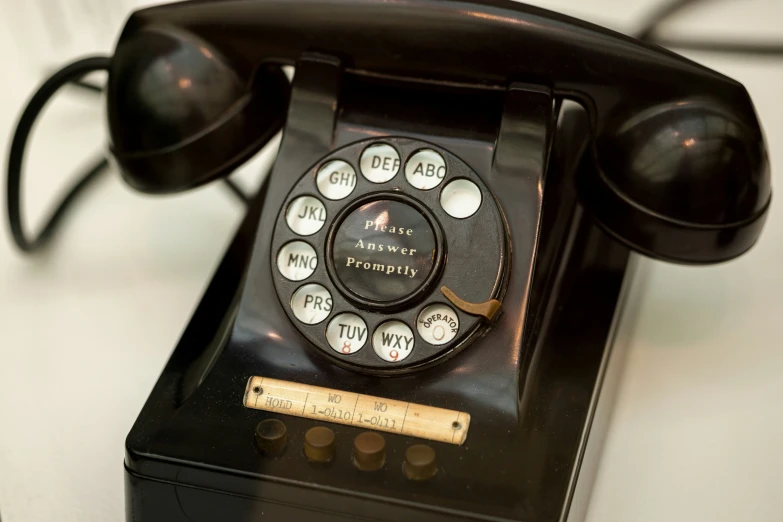 an old fashioned telephone sitting on a table