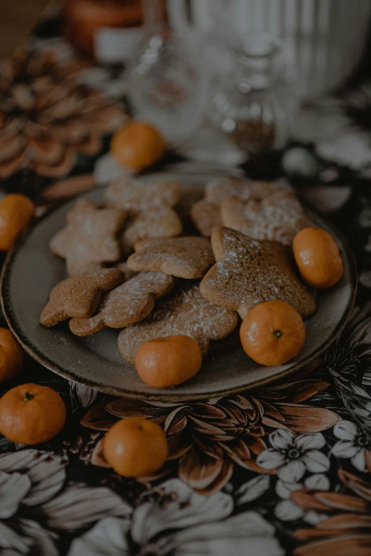 small cookies with orange slices on a plate