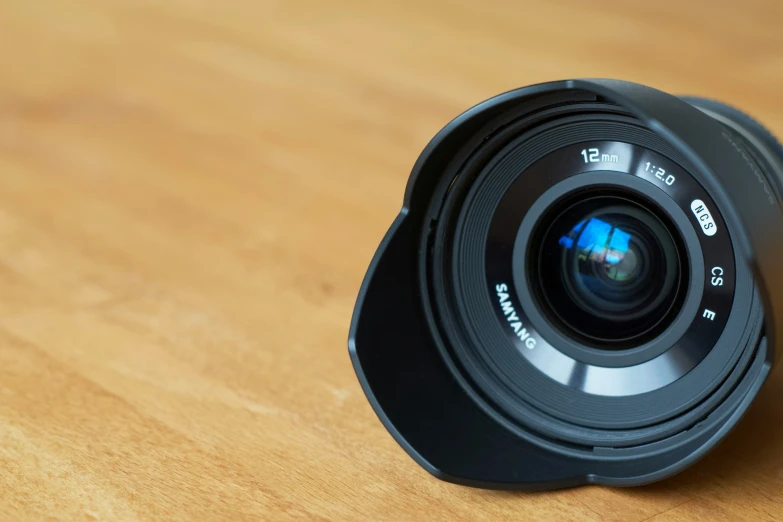 the front view of a camera sitting on a table