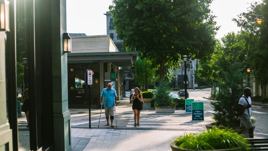 two people are walking on the street with no cars