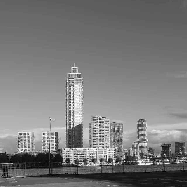 a view of some very tall buildings next to a harbor