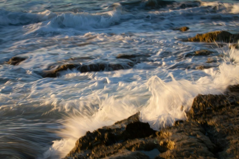 the ocean's breaking waves come to land on some rocks