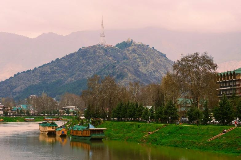 there are two boats moored near a large lake