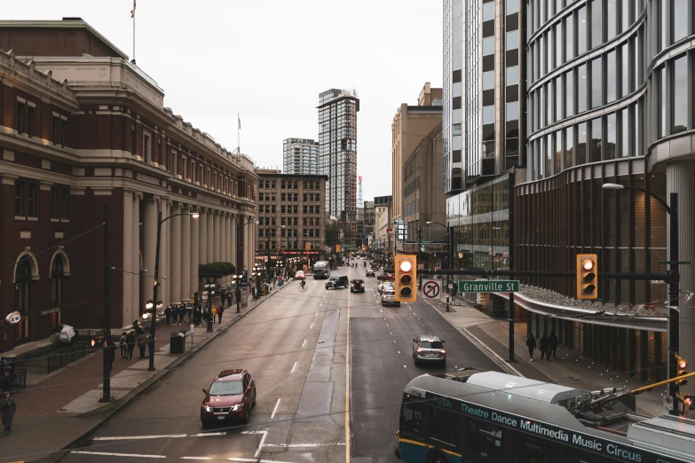 a street with cars and pedestrians in it