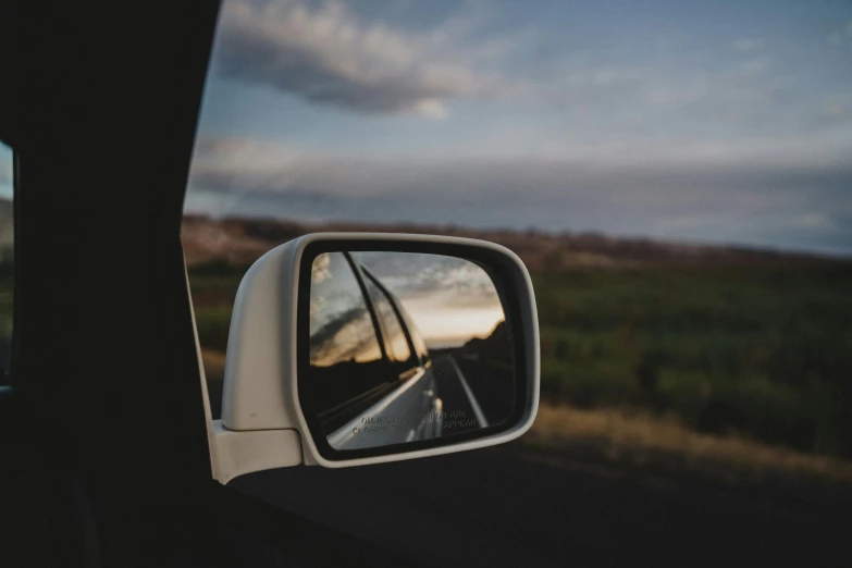 a picture of the rear view mirror of a car