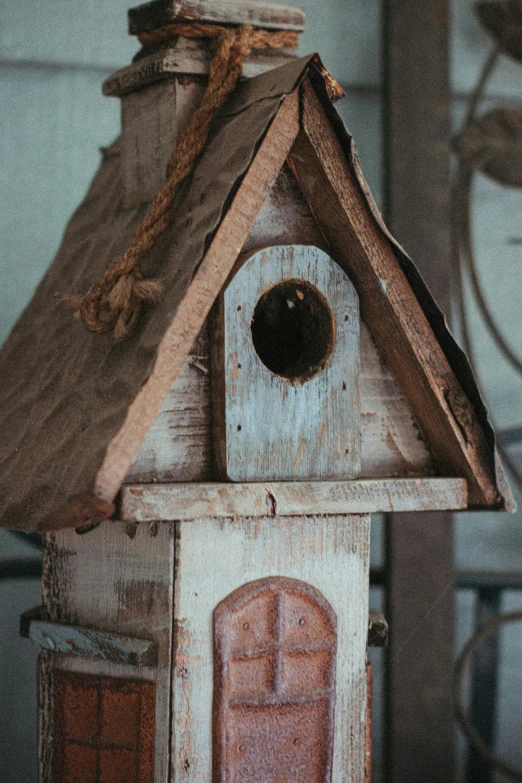 a bird house made from an old window frame