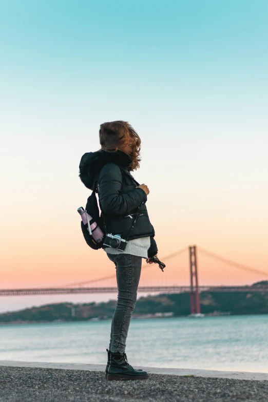 a woman standing with her back to the camera