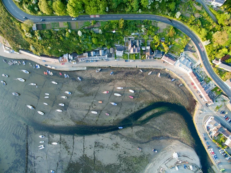 aerial view of the parking lot of a large residential area near water