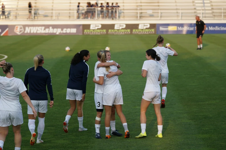 women soccer players celeting on the field