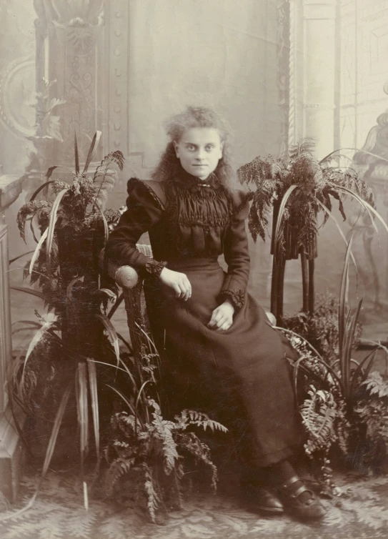 a woman in an antique black and white pograph