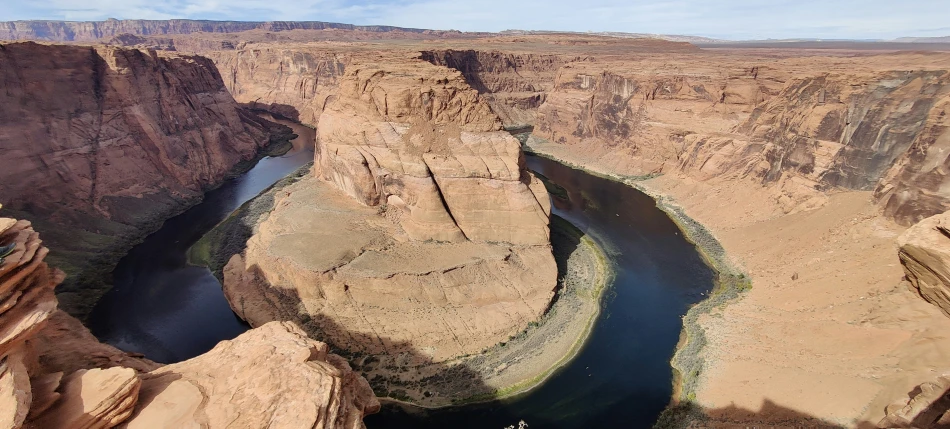 there is a river coming out of the canyon