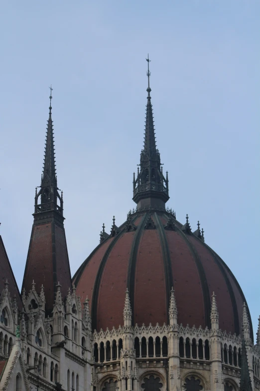 the clock is on the dome of a building