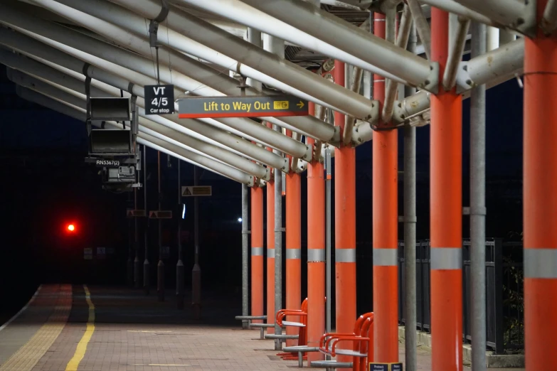 traffic lights and orange posts along the road