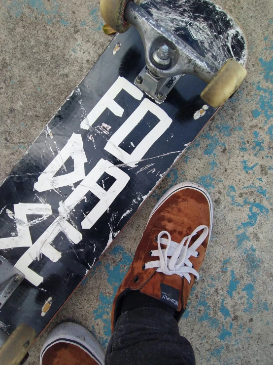 a person is standing on a skateboard next to it