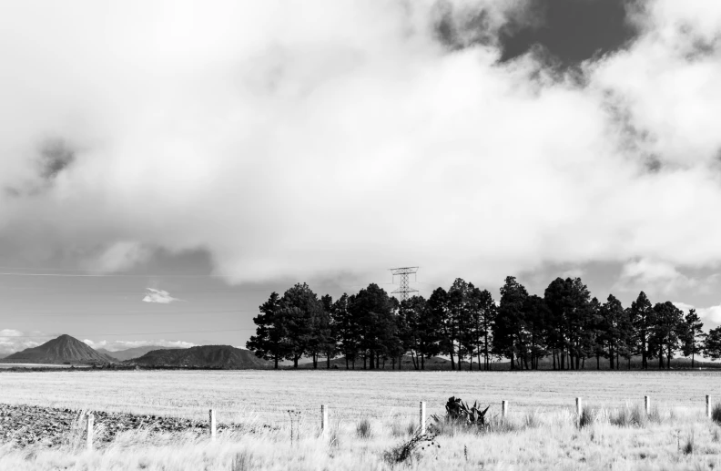 the cloudy skies are shining in this black and white po