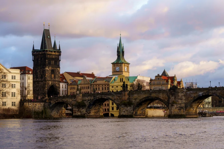 a city with a bridge and some old buildings