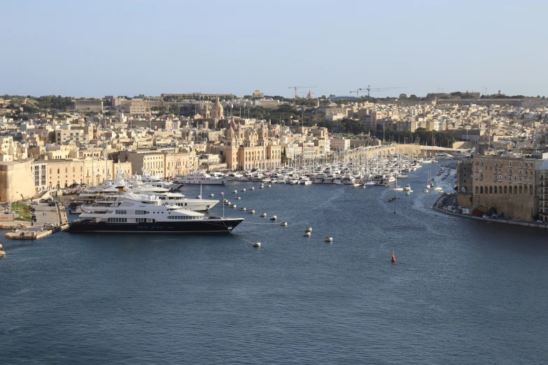 a wide body of water with boats floating in it