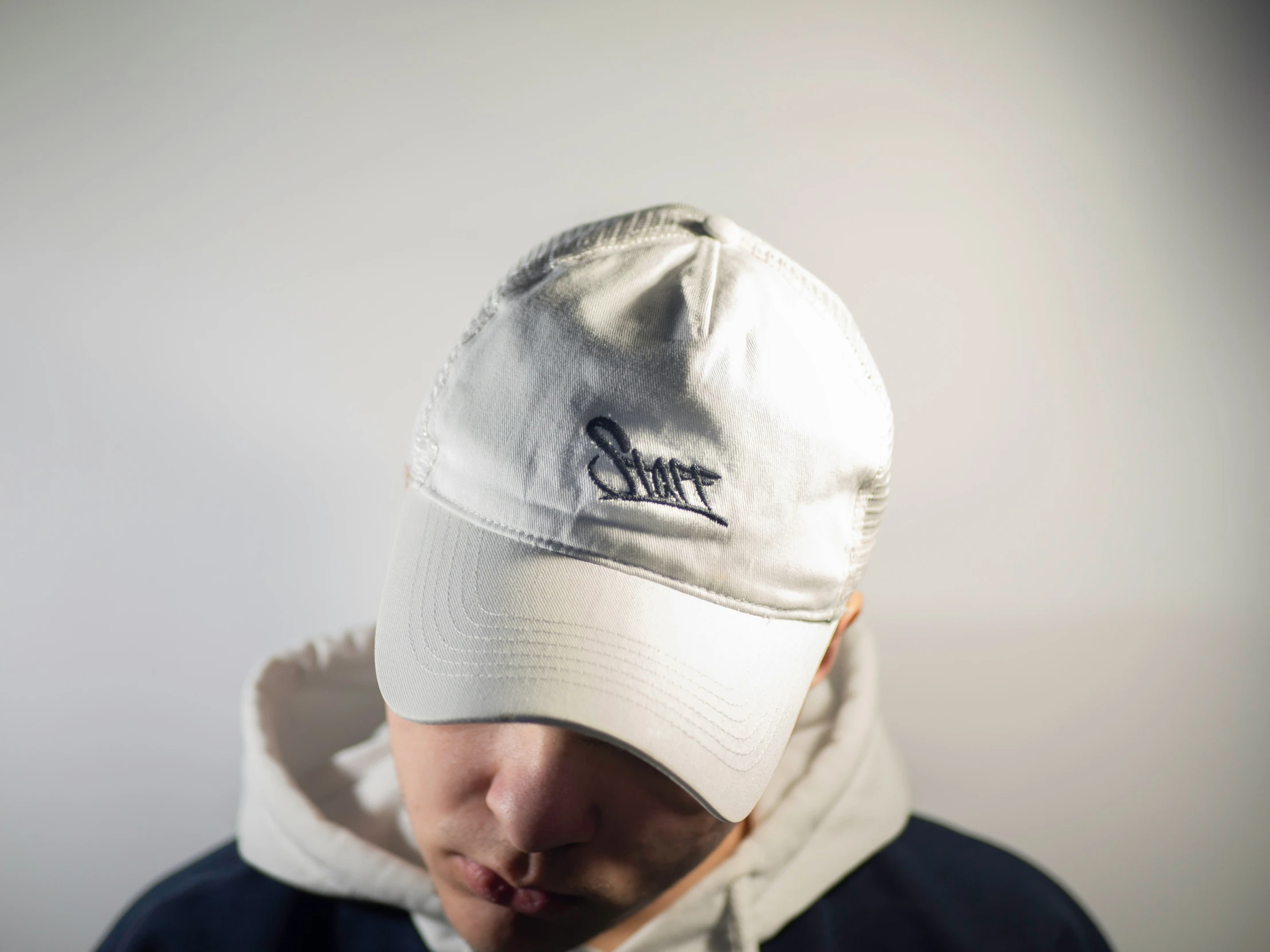 a man in a white hat with a white shirt on