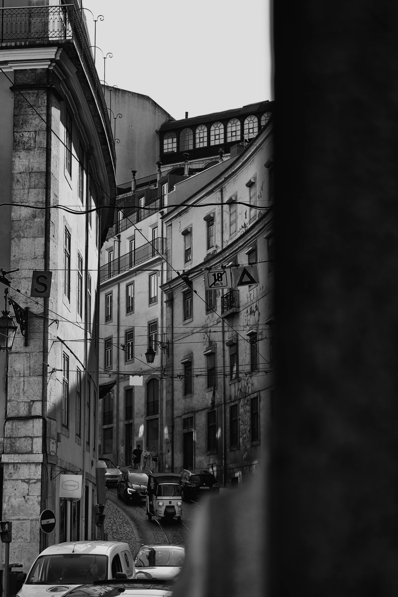 a black and white image of an old town street