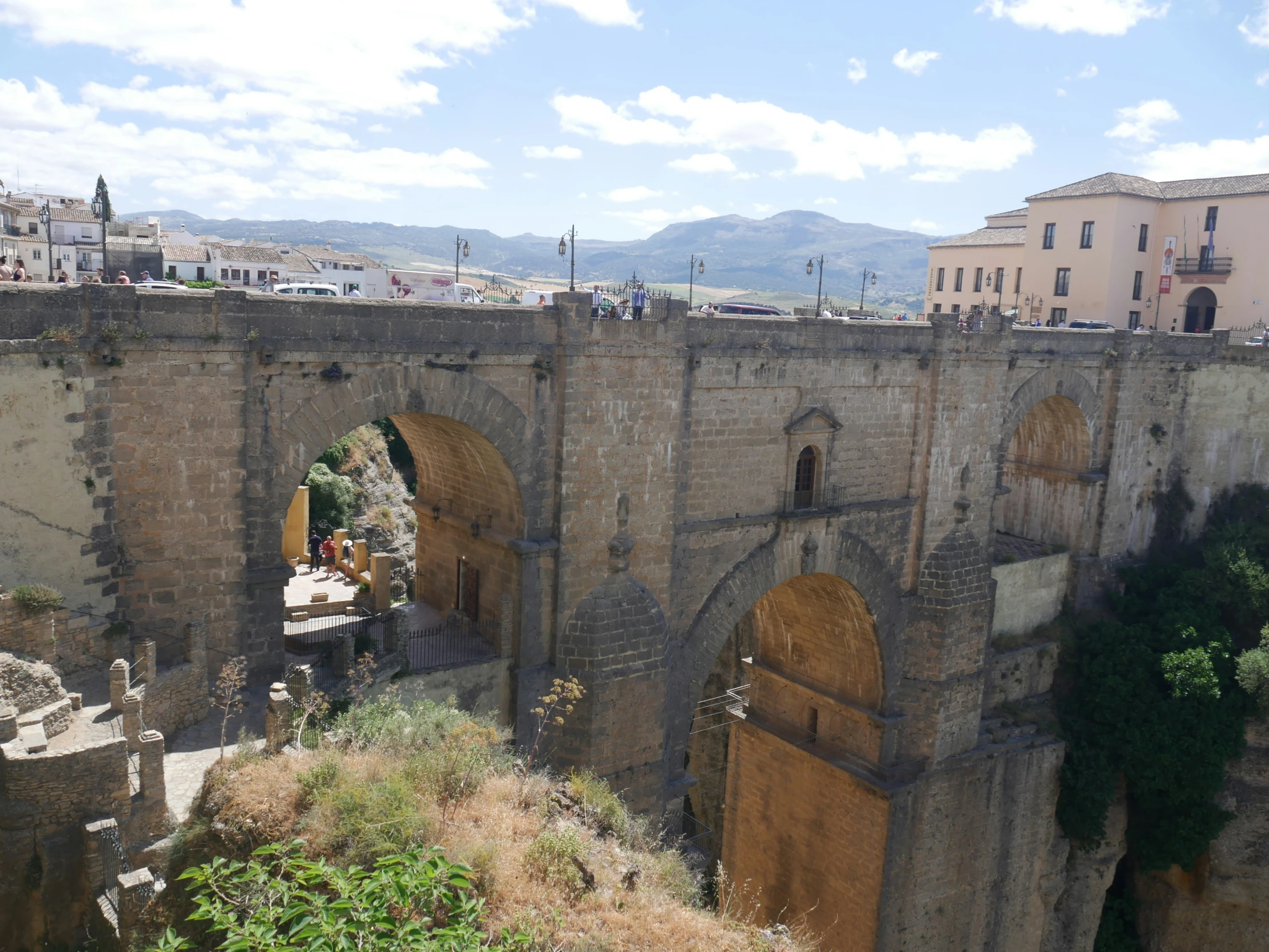 a po of the old town with many people walking along the walls