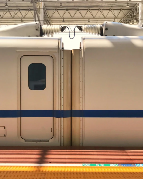 a couple of trains are parked at a station