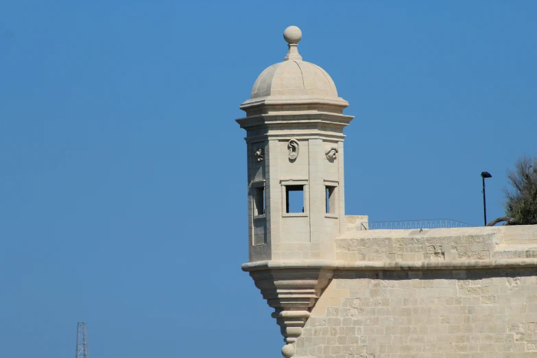 a view of a clock tower with the sky in the background