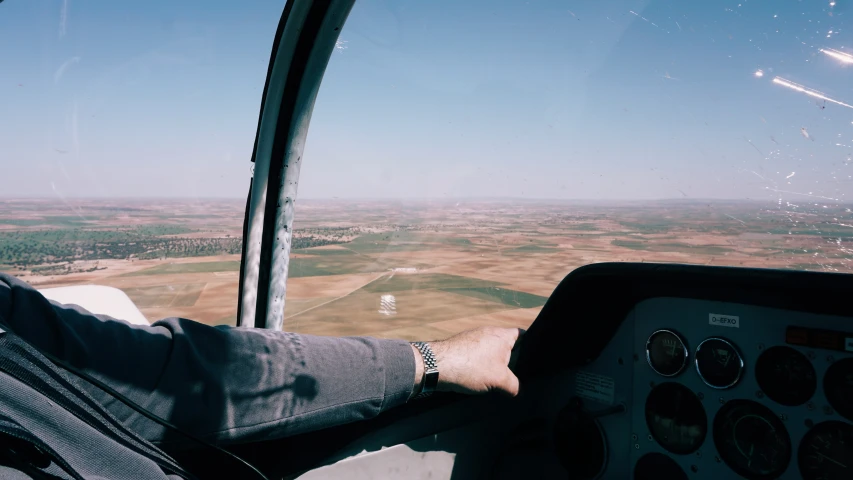 a man sits in the front seat of a jet