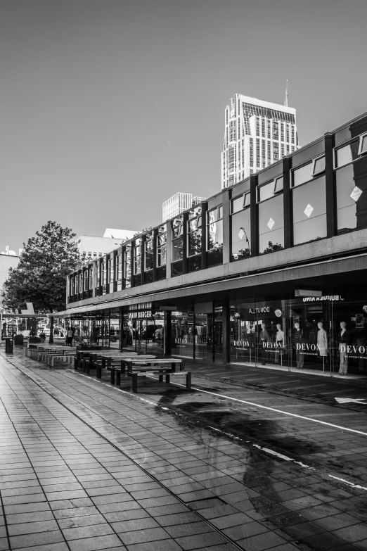 a black and white image of an outdoor mall