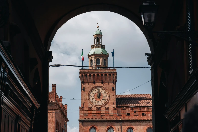 looking through a gate at a clock tower